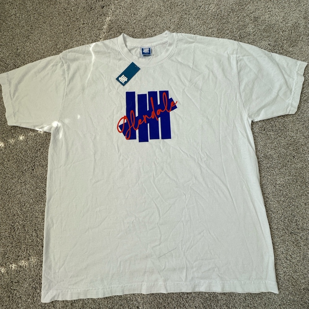 Undefeated White Tee with Blue and Red Logo